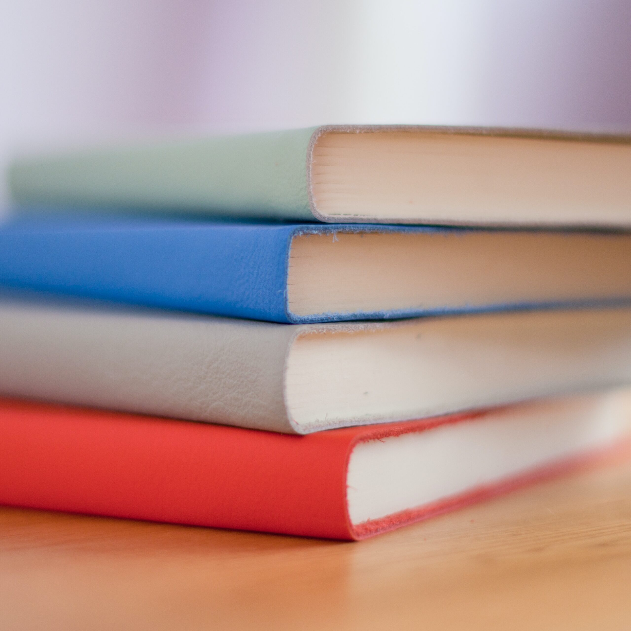 Stack of four colorful books
