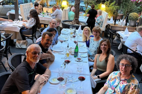 Researchers are gathered around a dining table