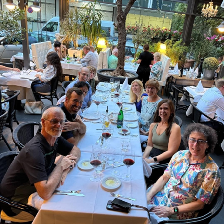 Researchers are gathered around a dining table