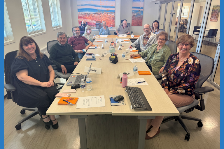 Panel sitting at a table