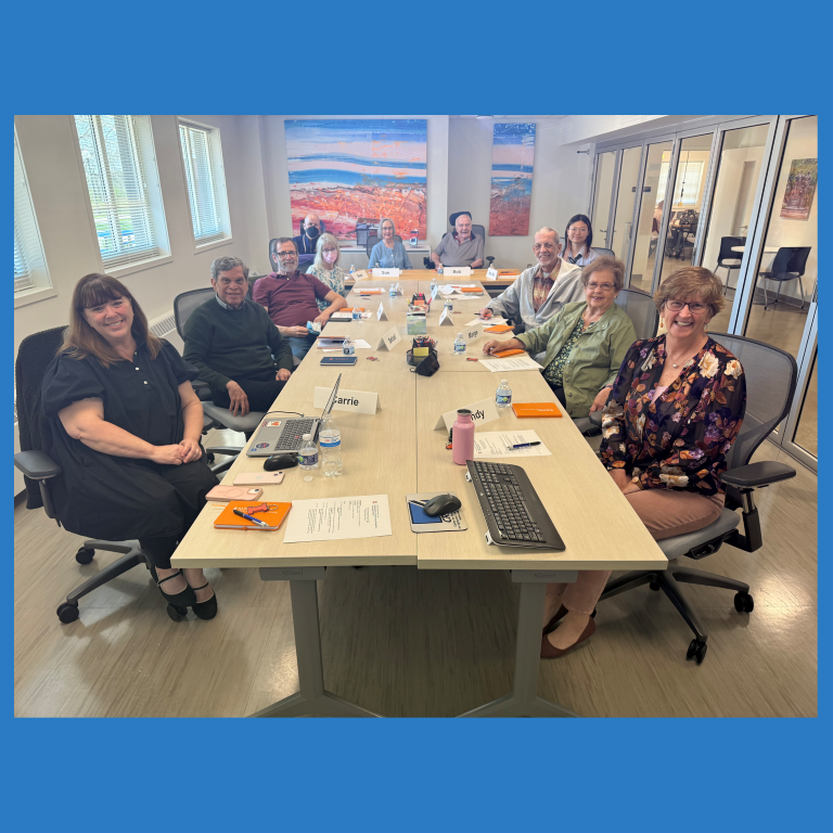 Panel sitting at a table